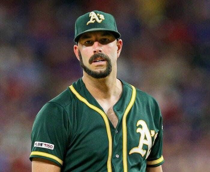 Oakland A's starter Mike Fiers with a beard that wraps down around his mouth and the hooks back up around and makes his mustache.