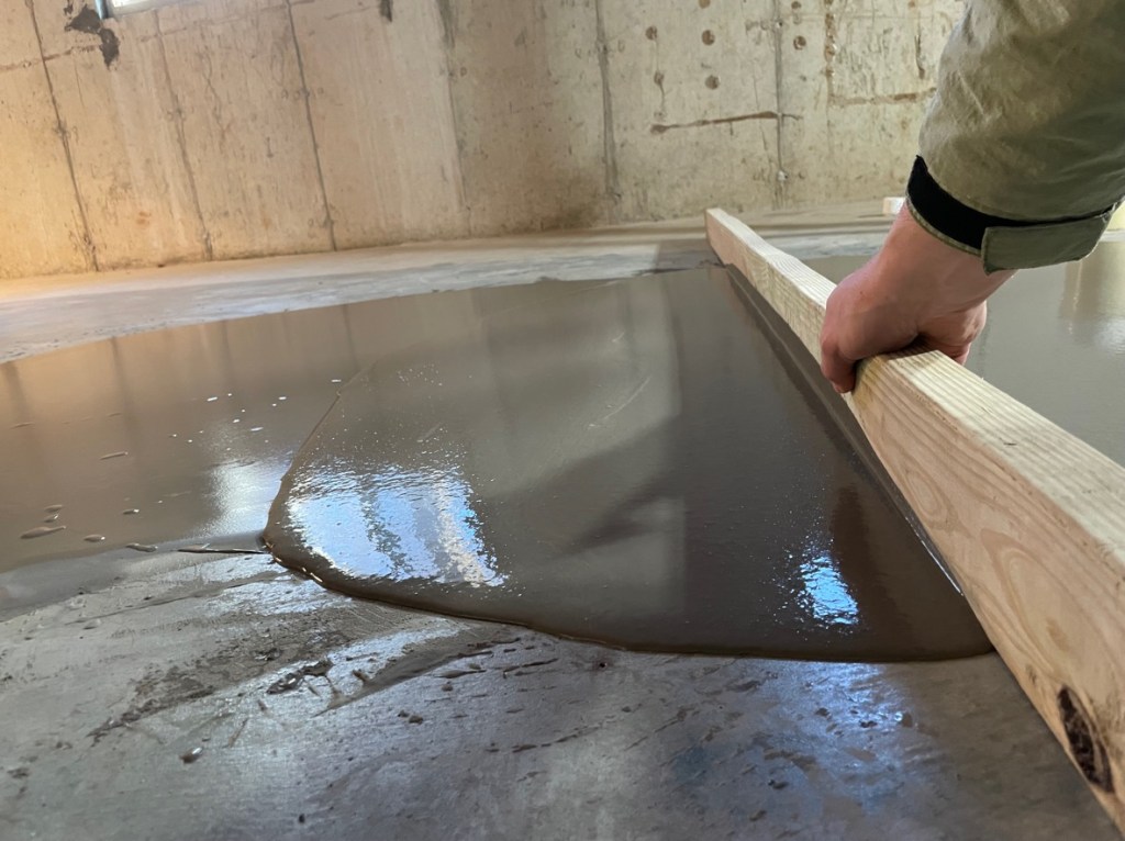 Words cannot express how satisfying it was to pour very liquid cement 
on the floor of my basement and strike it out to level the floor.