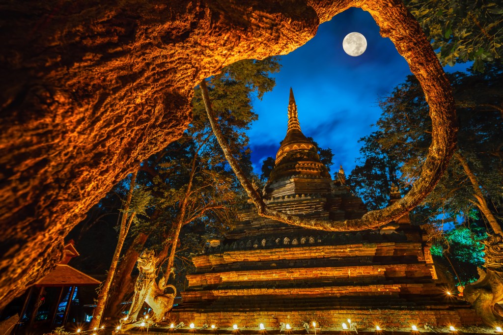 Lights from the candle lit at night around the church of Buddhist in Thailand
By somchairakin